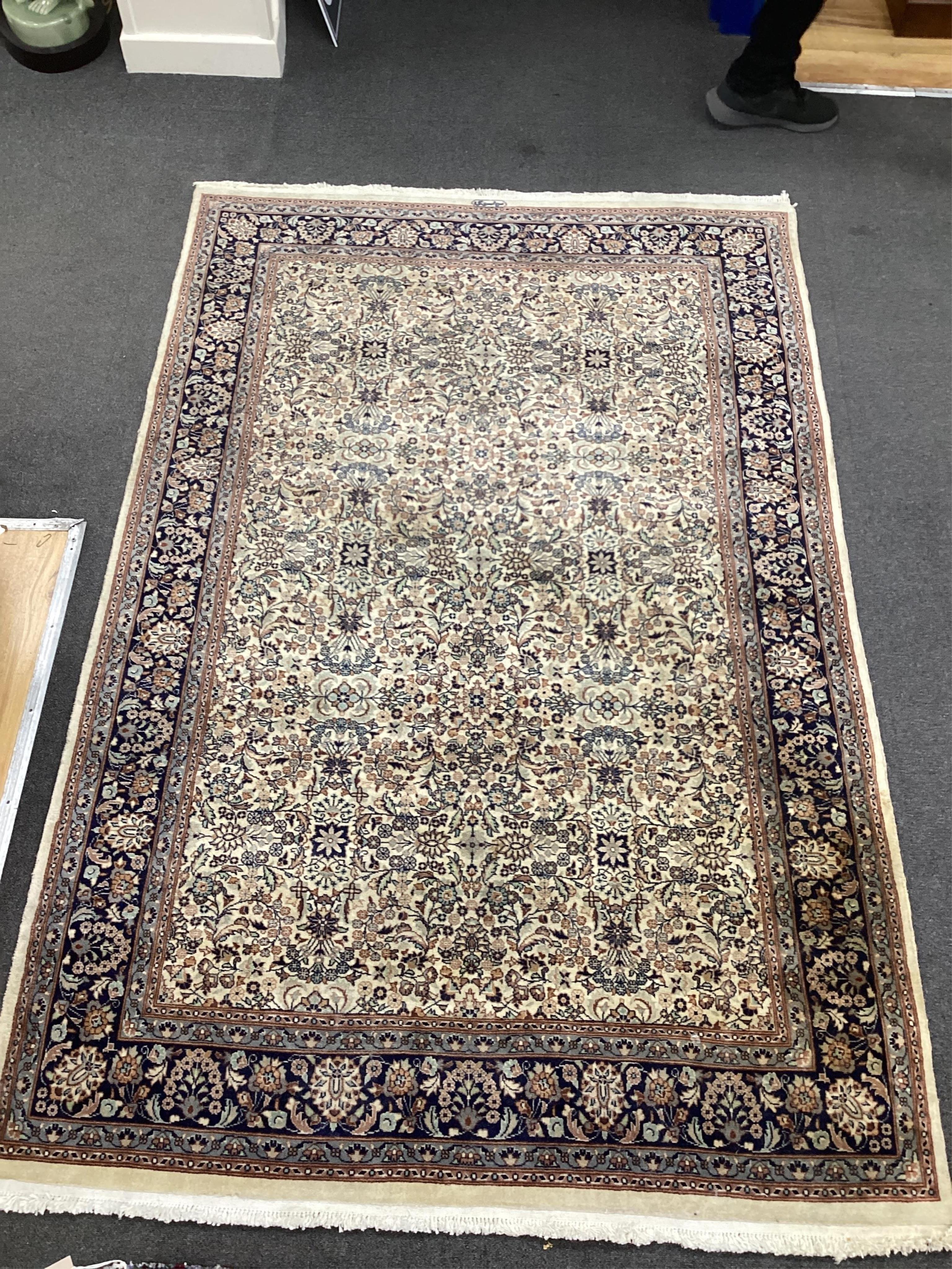 An Hereke ivory ground rug, 204 x 136cm. Condition - good